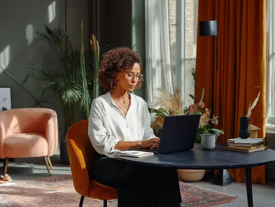 Professional working at laptop